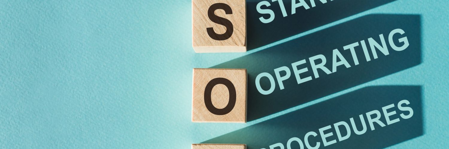 Three wooden blocks with the letters "SOP" on them cast shadows that spell out "Standard Operating Procedures."